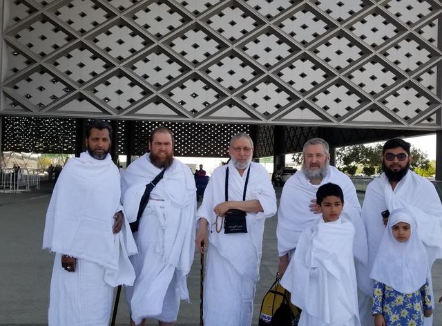 Amity travelers and children in ihram outside the Haramain railway station